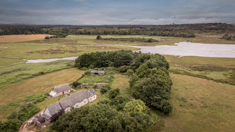 An aerial view of The Bakehouse, Middlebere Farmhouse and North Cottage, Dorset